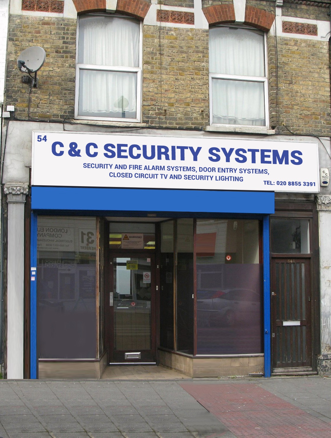 C&C Security Systems shopfront and full business-name sign at 54 Herbert Road, London